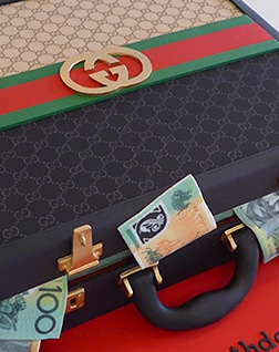 Elite Cake Designs - Novelty Birthday cake of a beautiful Gucci Mens  Briefcase with lots of dollars!