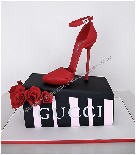 red stiletto shoe on a shoebox cake